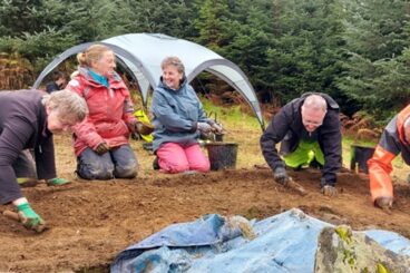 Local volunteers dig deep at Creag Liath ahead of storm