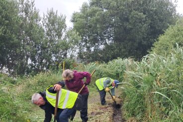 Volunteers spruce up start of West Island Way